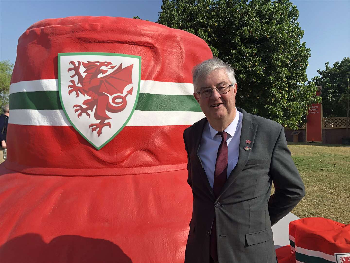 Wales First Minister Mark Drakeford in front of a giant bucket hat on the Corniche in Doha, Qatar (Bronwyn Weatherby/PA)