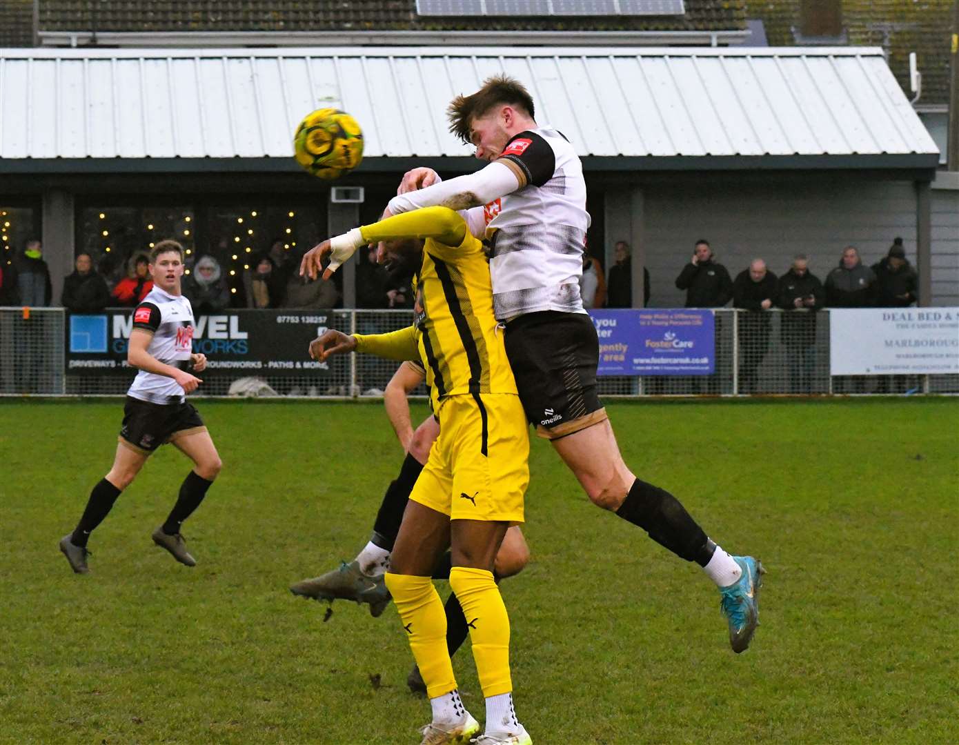 Deal Town defender Alfie Foster wins a header against Sheppey. Picture: Marc Richards