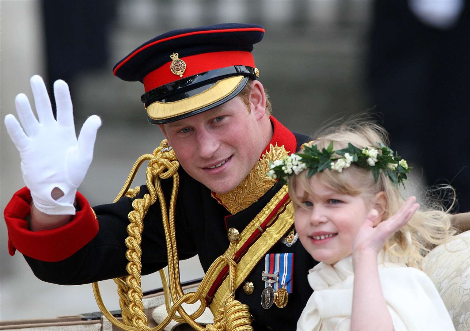 Prince Harry waves to the crowds with Louise after the Cambridges’ wedding (Steve Parsons/PA)