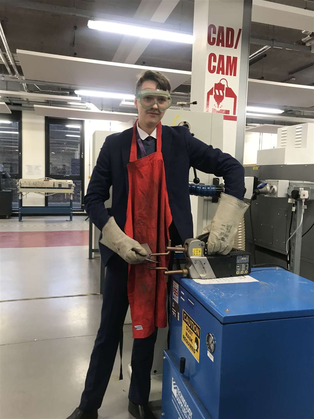 Sam Anderson,15, operates welder