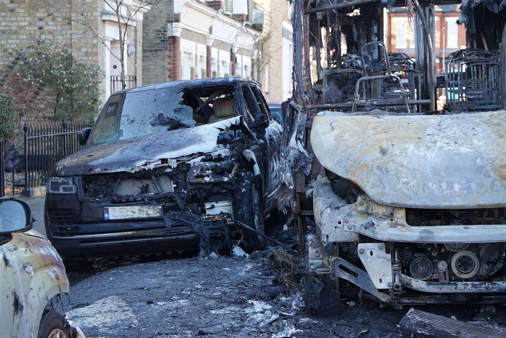 The burnt-out remains of a 30-seater bus that was damaged by fire (Eleanor Cunningham/PA)