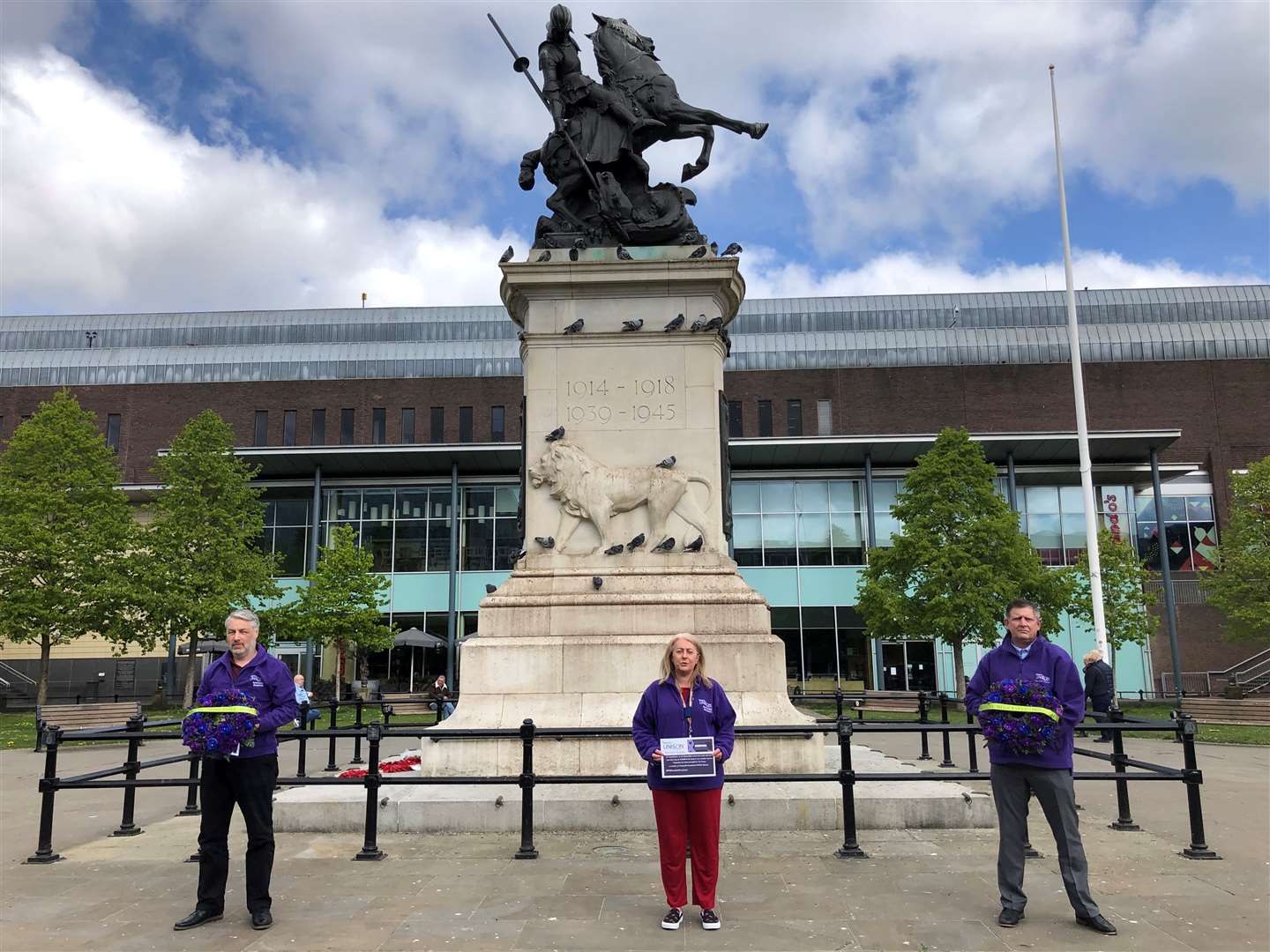 Unison representatives Joe McAtominey, Linda Hobson and Michael Barclay before they laid two wreaths at the War Memorial in Old Eldon Square, Newcastle, for key workers in the fight against Covid-19 (Tom Wilkinson/PA)