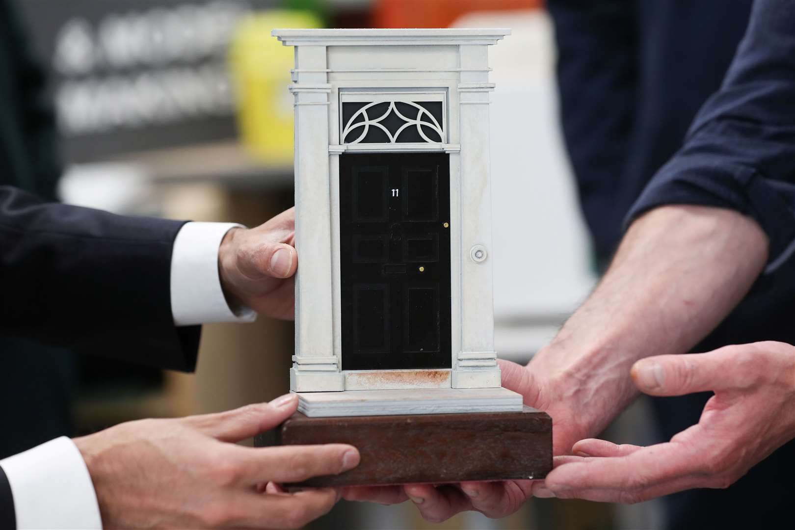 Students at the Northern School of Art presented the Chancellor with a model of the front door to 11 Downing Street (Lee Smith/PA)