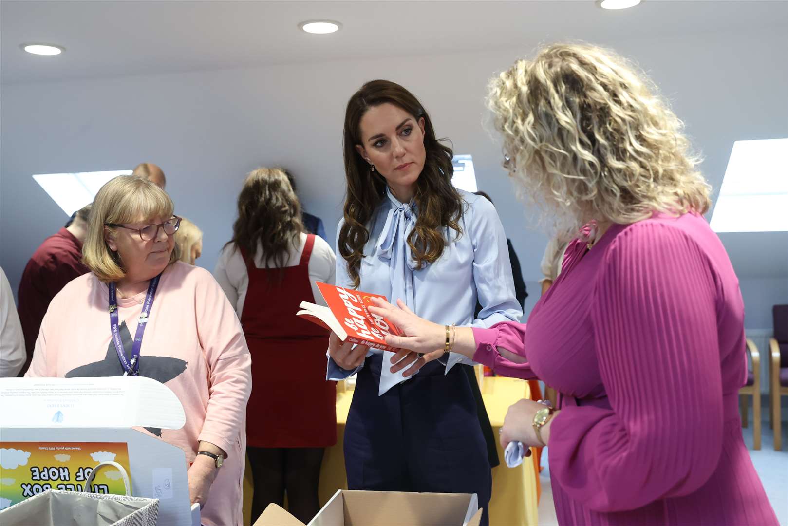 The Princess of Wales helps pack one of the charity’s Little Boxes of Hope (Liam McBurney/PA)