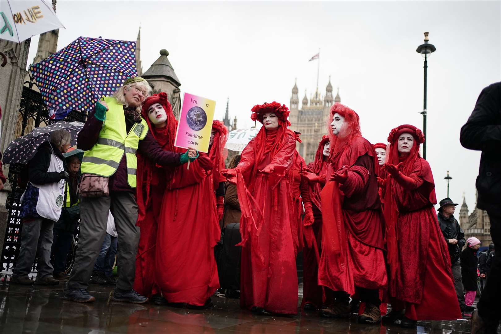 Members of the Red Rebel Brigade joined demonstrators in London (Jordan Pettitt/PA)