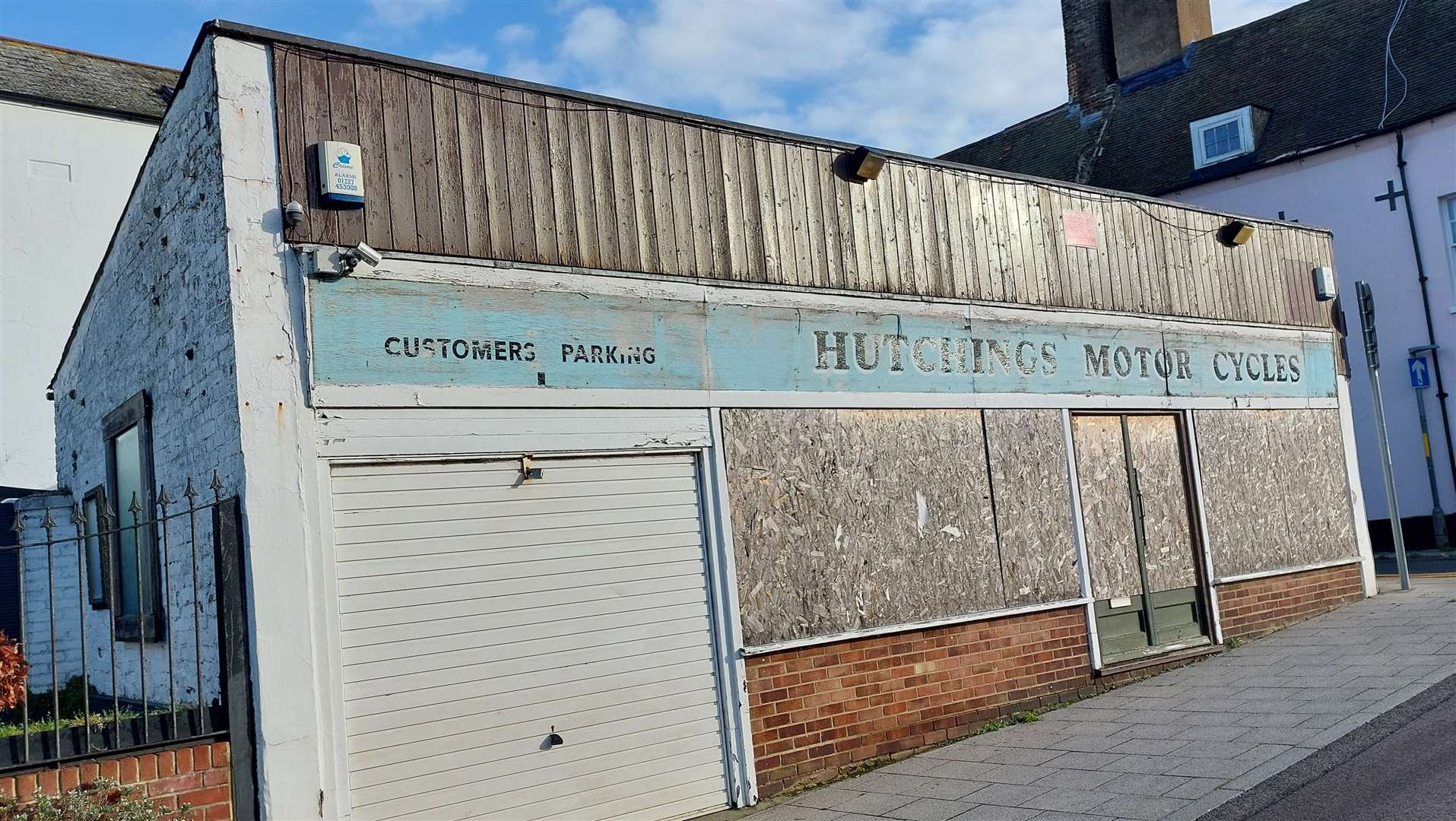 The boarded-up Hutchings Motorcycles shop has been described as “scruffy” and “unsightly”