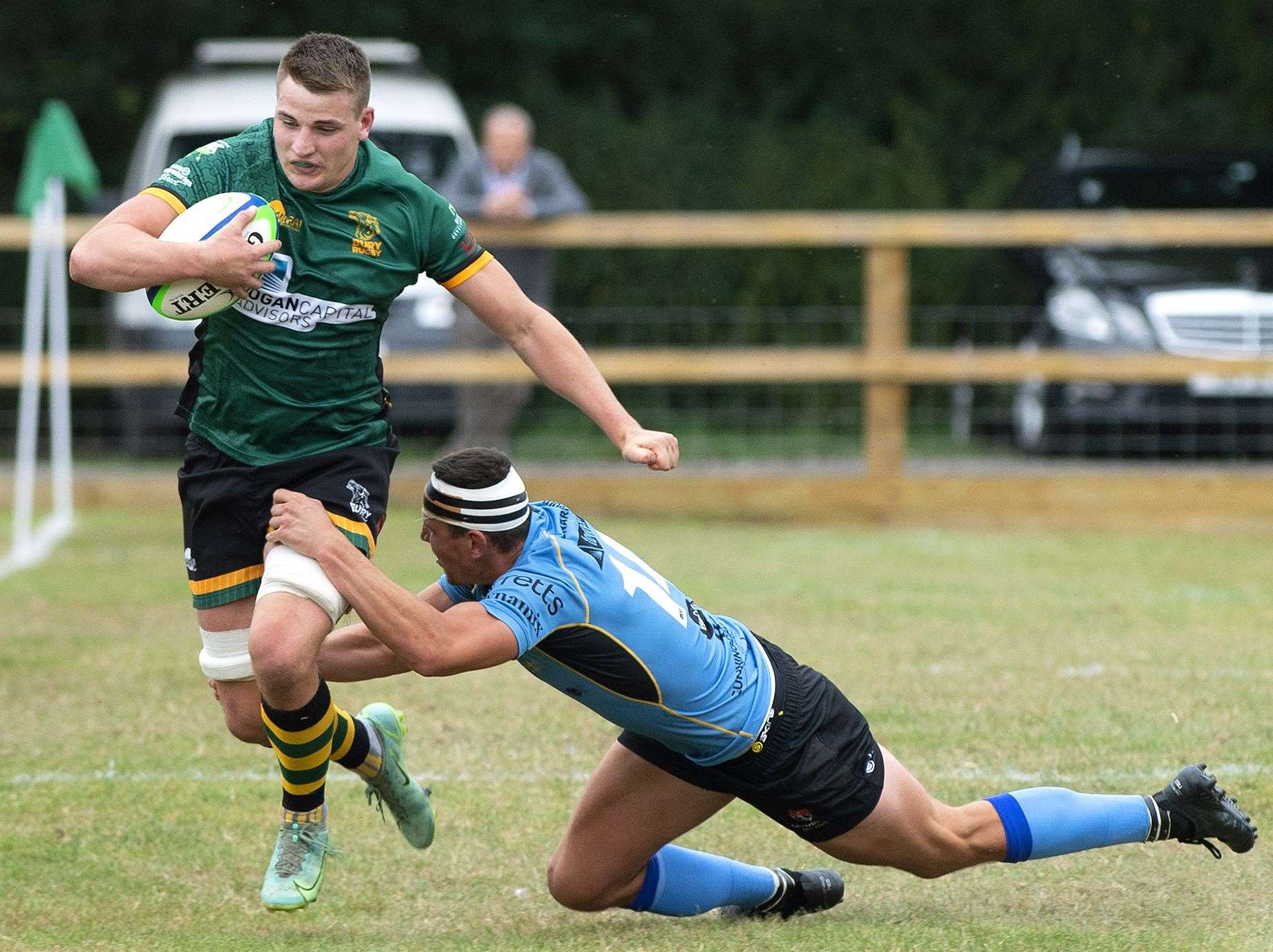 Canterbury (blue) attempt to stop Bury St Edmunds in their tracks. Picture: Mecha Morton (50922985)