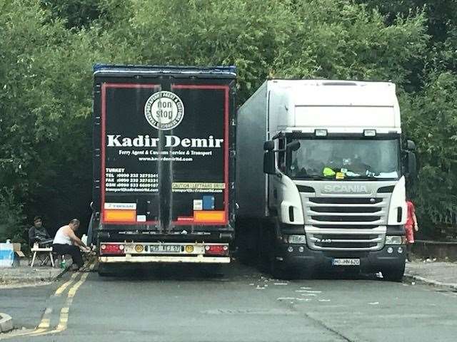 A parking ticket sits on the windscreen of a parked up lorry, while drivers set up for the night. Pic: Nick Blake