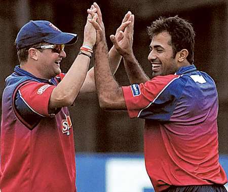 Rob Key and Wahab Riaz celebrate the latter's wicket hail against Gloucestershire