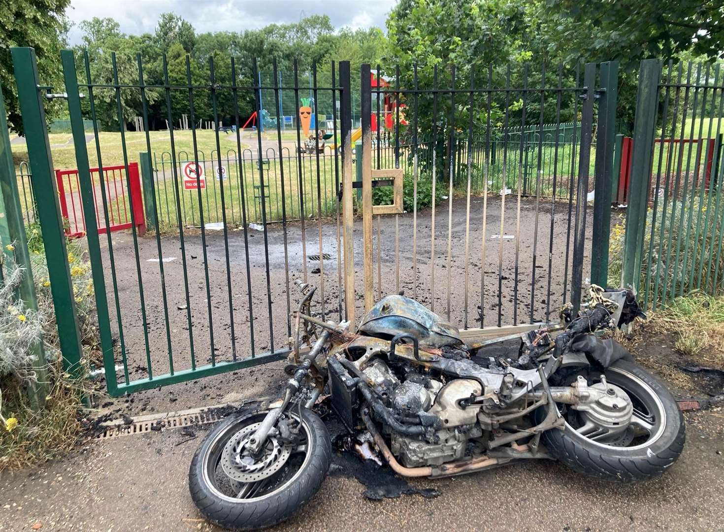 A burnt bike was found next to Wilmot Park in Dartford