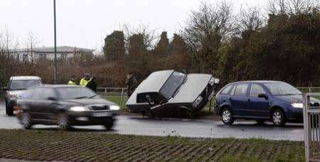 A car mounts railings near Medway City Estate