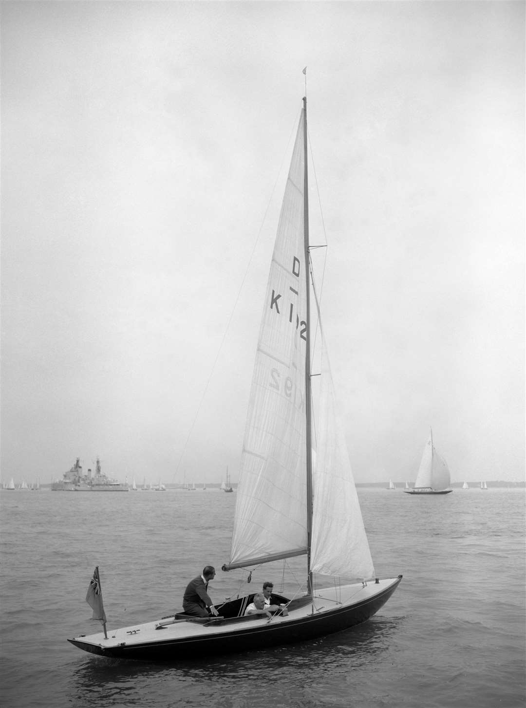 The Duke of Edinburgh in Bluebottle during Cowes Regatta Week in 1961 (PA)