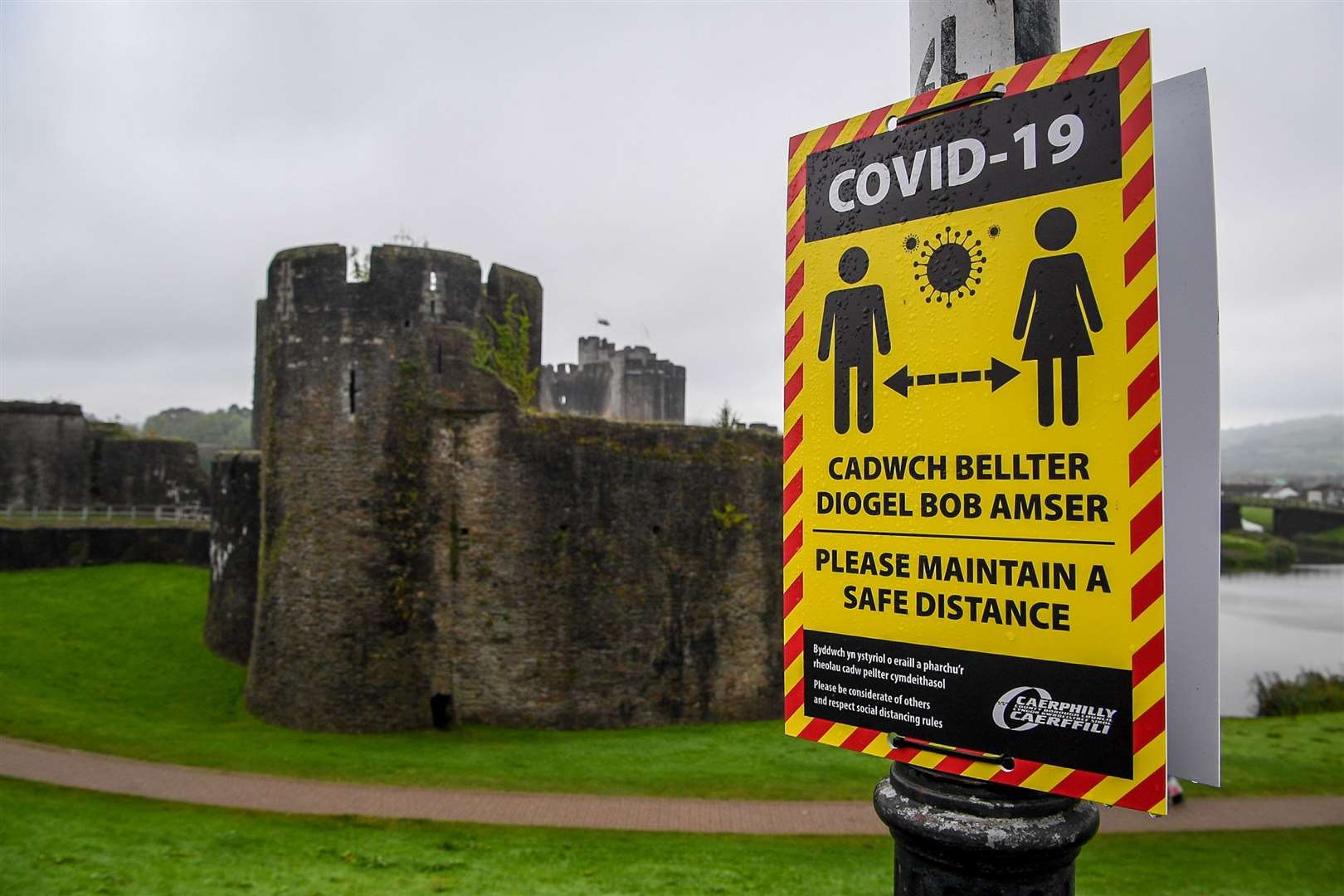 Attractions in Wales, like Caerphilly castle, are following a different timeline on the easing of restrictions to ones in England (Ben Birchall/PA)