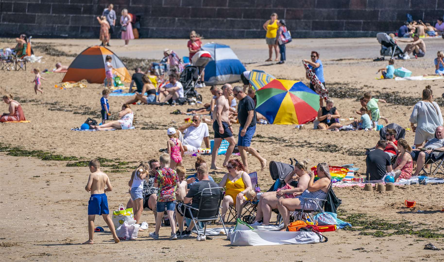 The sea breeze gave families a chance to cool down (Peter Byrne/PA)