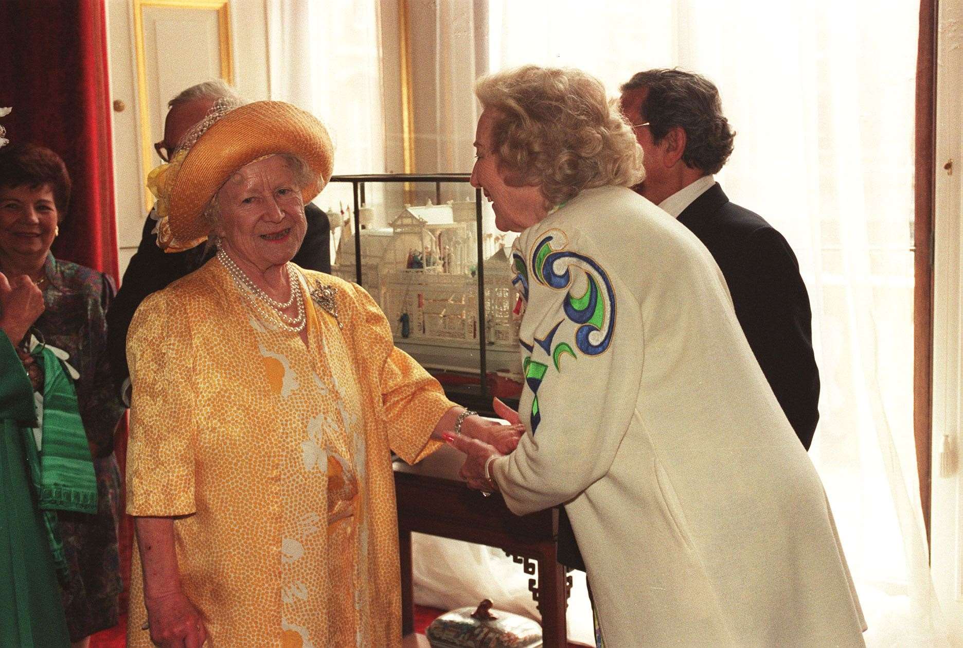 Dame Vera Lynn meeting the Queen Mother in Buckingham Palace on the 50th anniversary of VE Day (Rebecca Naden/PA)