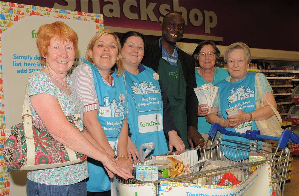 David Idowu, from the Food Bank, collecting with staff and customers at Tesco.
