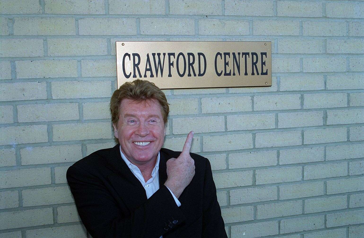 Michael Crawford couldn't resist a laugh when he opened the Crawford Centre in Sheerness on November 5, 2001