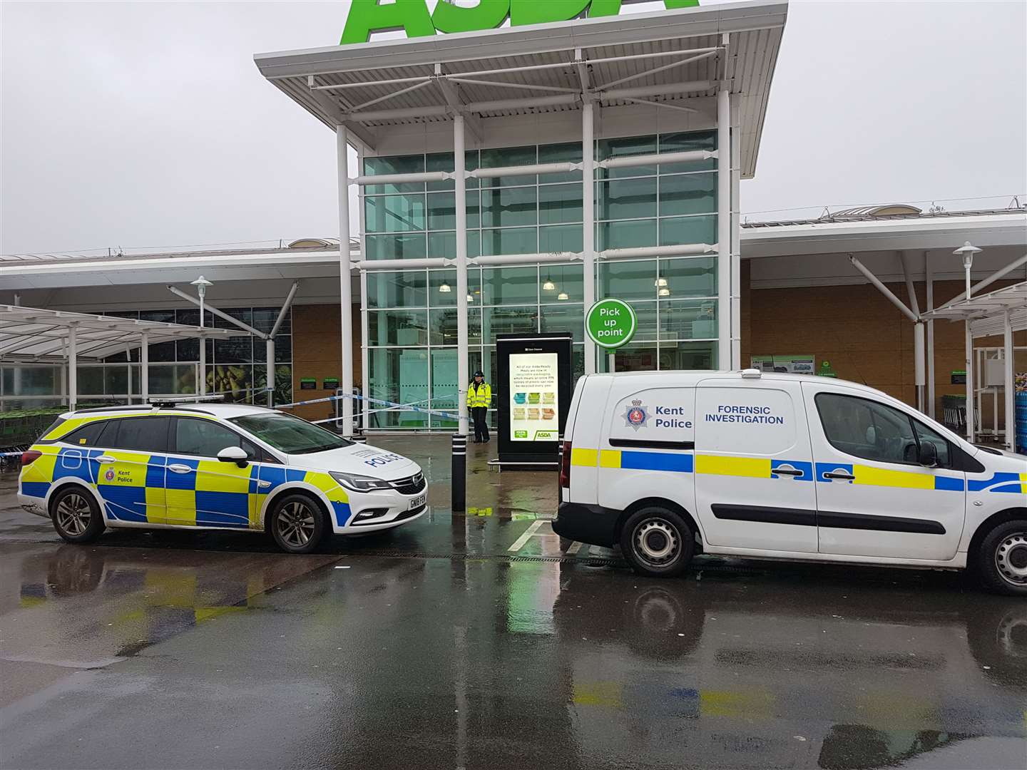 Police vehicles parked outside the store