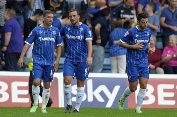 Danny Kedwell celebrates with team-mates after scoring his second goal against MK Dons. Picture: Barry Goodwin