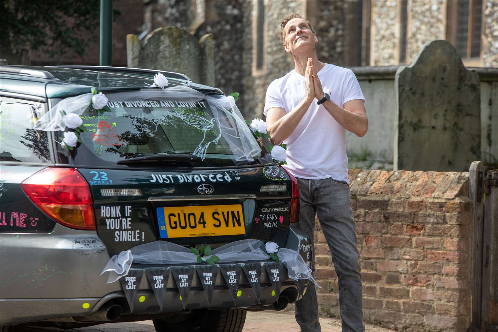 Angus Kennedy with his specially modified car. Images: SWNS