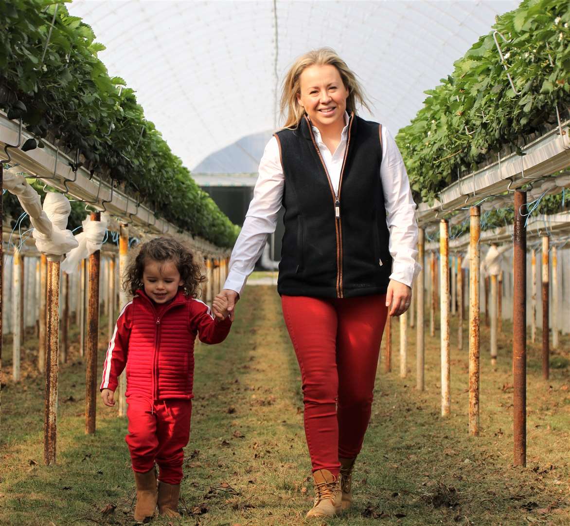 HARVEST TIME: Annabel Makin Jones with her daughter at the farm