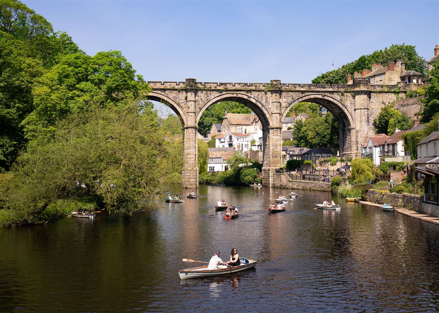 People row boats underneath the Knaresborough Viaduct on the River Nidd in North Yorkshire (Danny Lawson/PA)