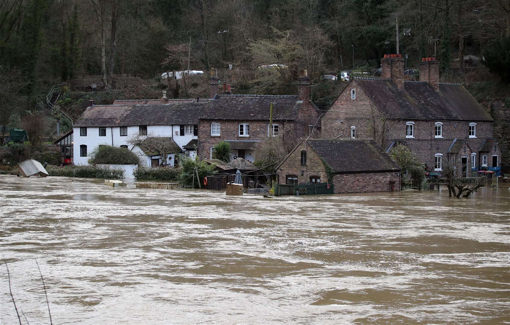 The Vic Haddock boat house under water on the River Severn following high winds and wet weather in Ironbridge, Shropshire (Nick Potts/PA)