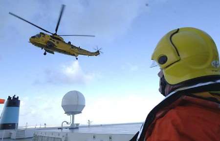 VIEW FROM THE DECK: a helicopter crew about to put colleagues on to the ship. Pictures: PAUL DENNIS