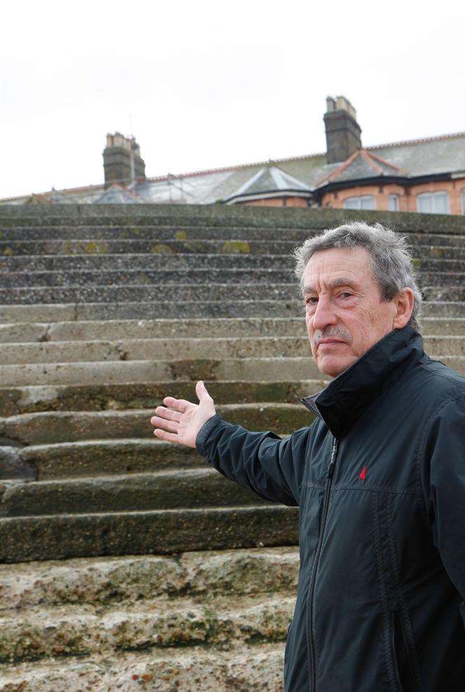 Tim Bell of the Sheppey Coastal Protection Group showing damage to the sea wall. The shingle used to come up to the third step from the top and now sea damage is occurring.