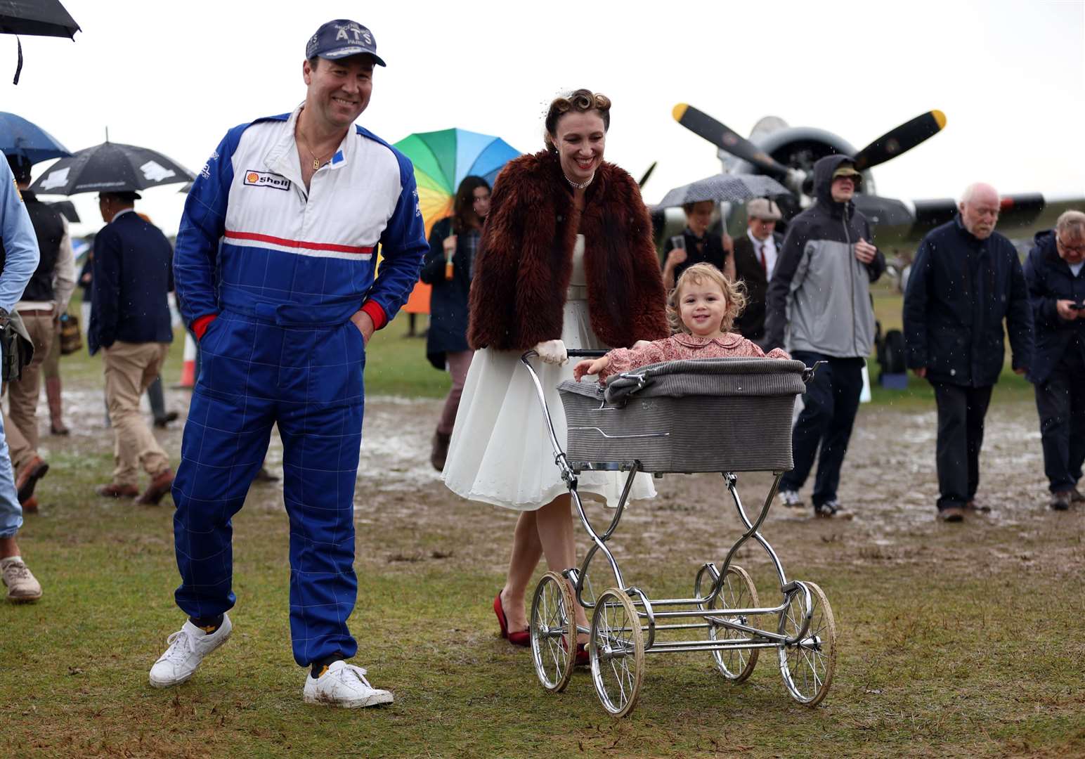 A family in vintage fashion at the Goodwood Revival (Kieran Cleeves/PA)