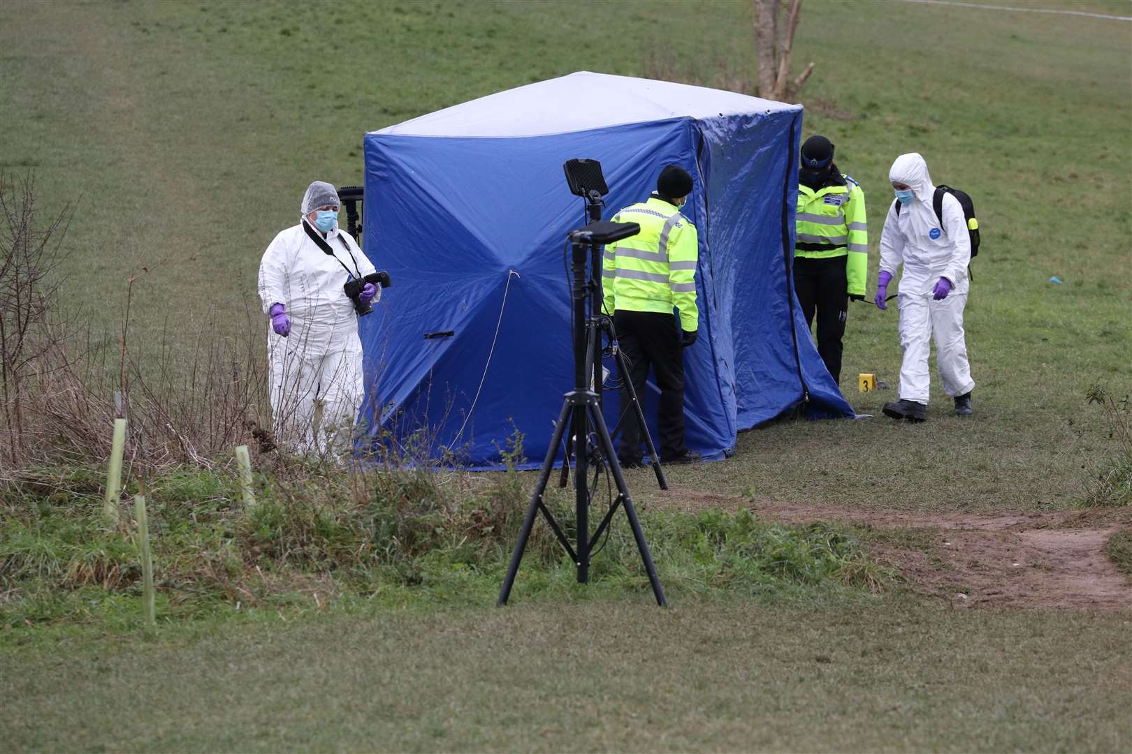 Forensics officers at Bugs Bottom fields in Emmer Green (Jonathan Brady/PA)