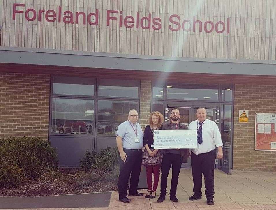 Tim Johnston donating money made from the books to the Foreland Fields School in Ramsgate. (18384029)