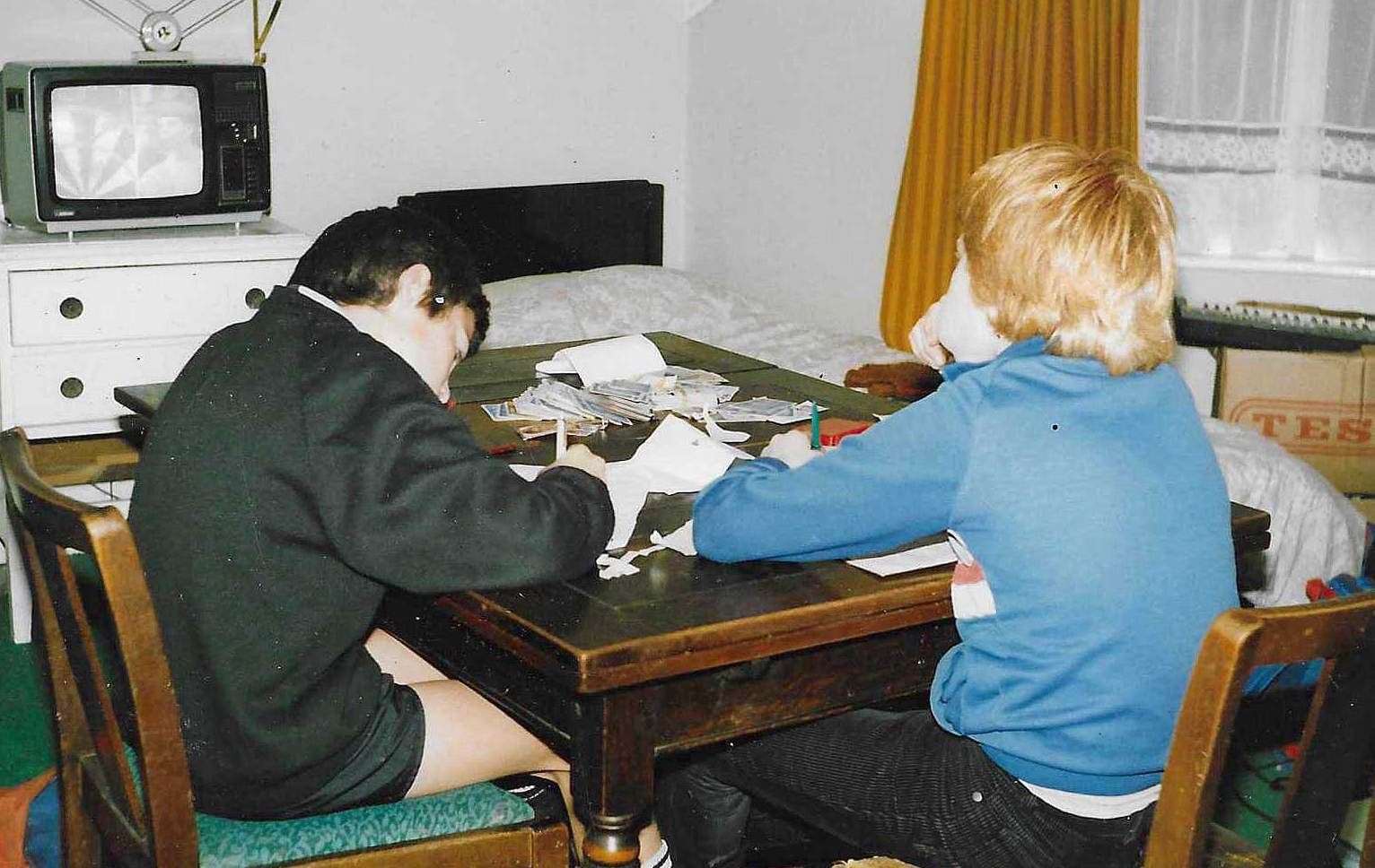 Dan Potter, right, with his brother Nicholas Potter, sketch at the family table at his childhood home in Alma Street, Sheerness. Picture: Dan Potter