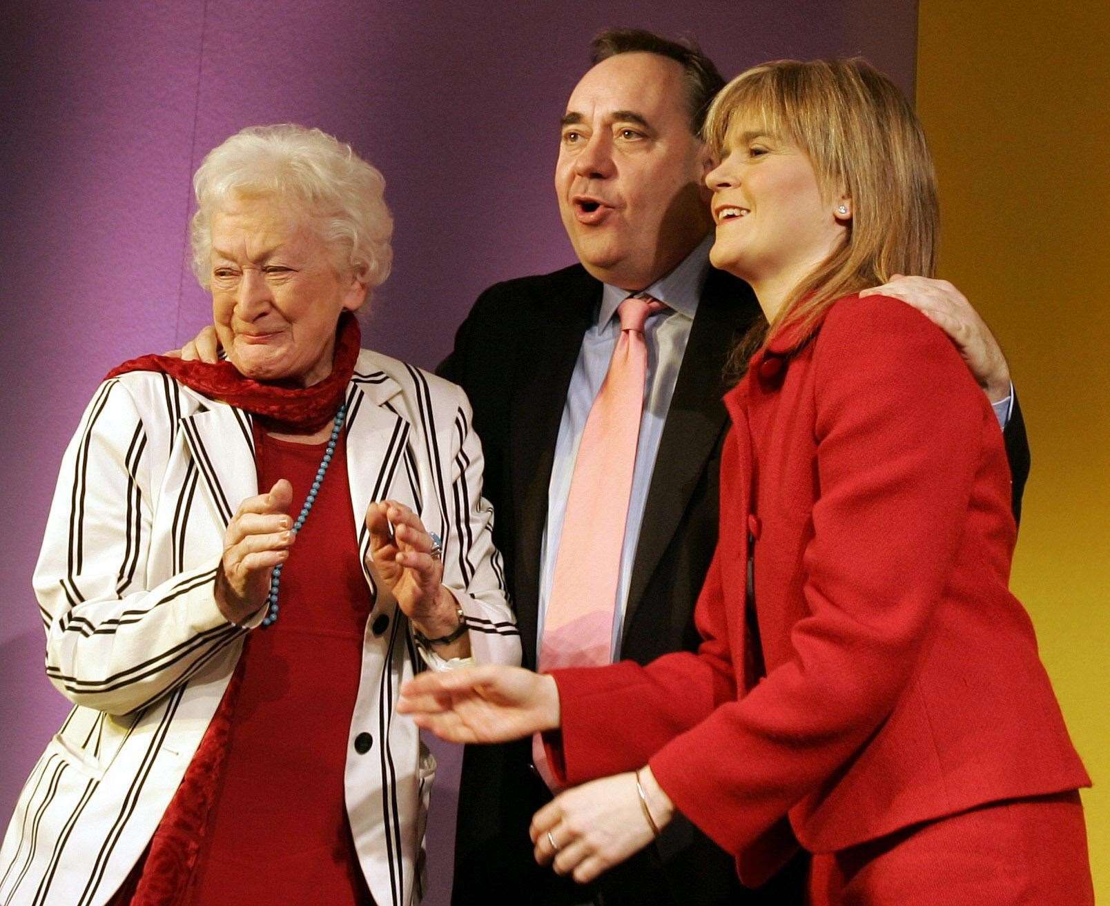 Mrs Ewing with Alex Salmond and Nicola Sturgeon in 2005 (PA)