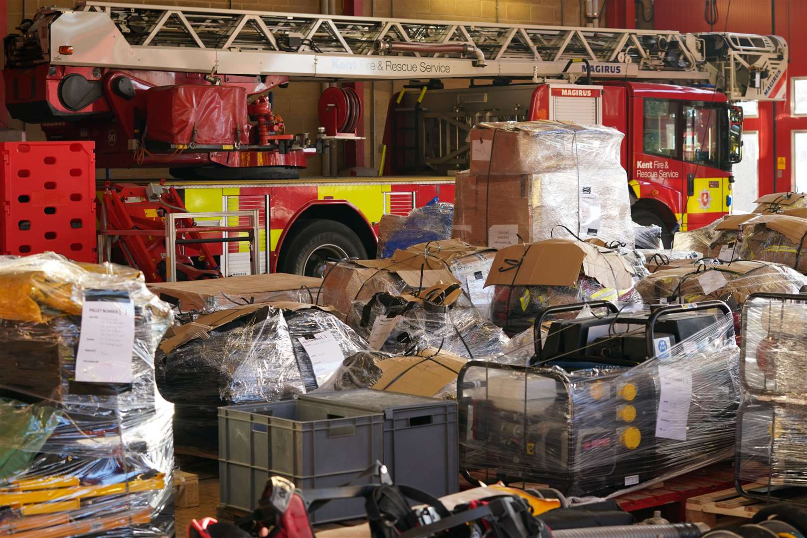 Donated emergency service equipment was loaded at Ashford fire station (Gareth Fuller/PA)