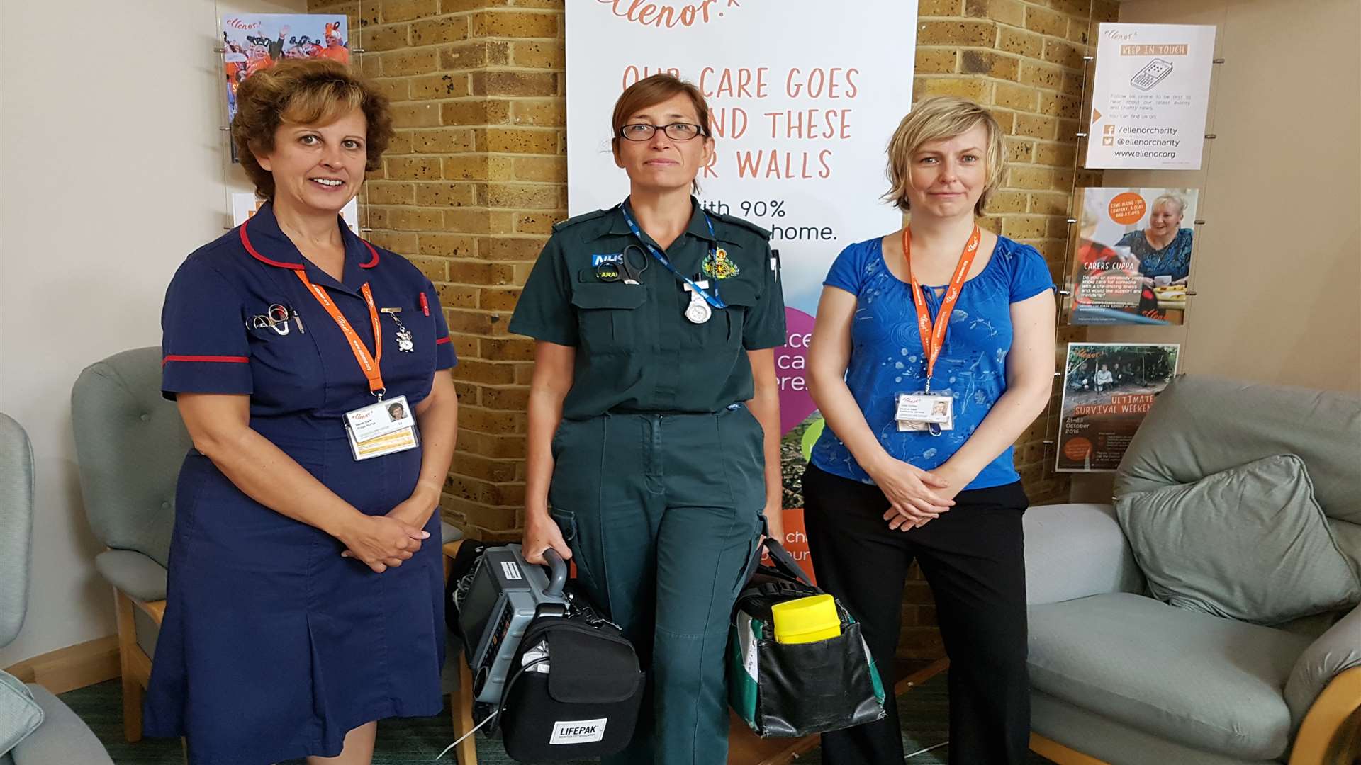 Dawn Dark, triage nurse at ellenor, and Linda Coffey, Head of Adult Community Services at ellenor, flank a member of SECAmb crew