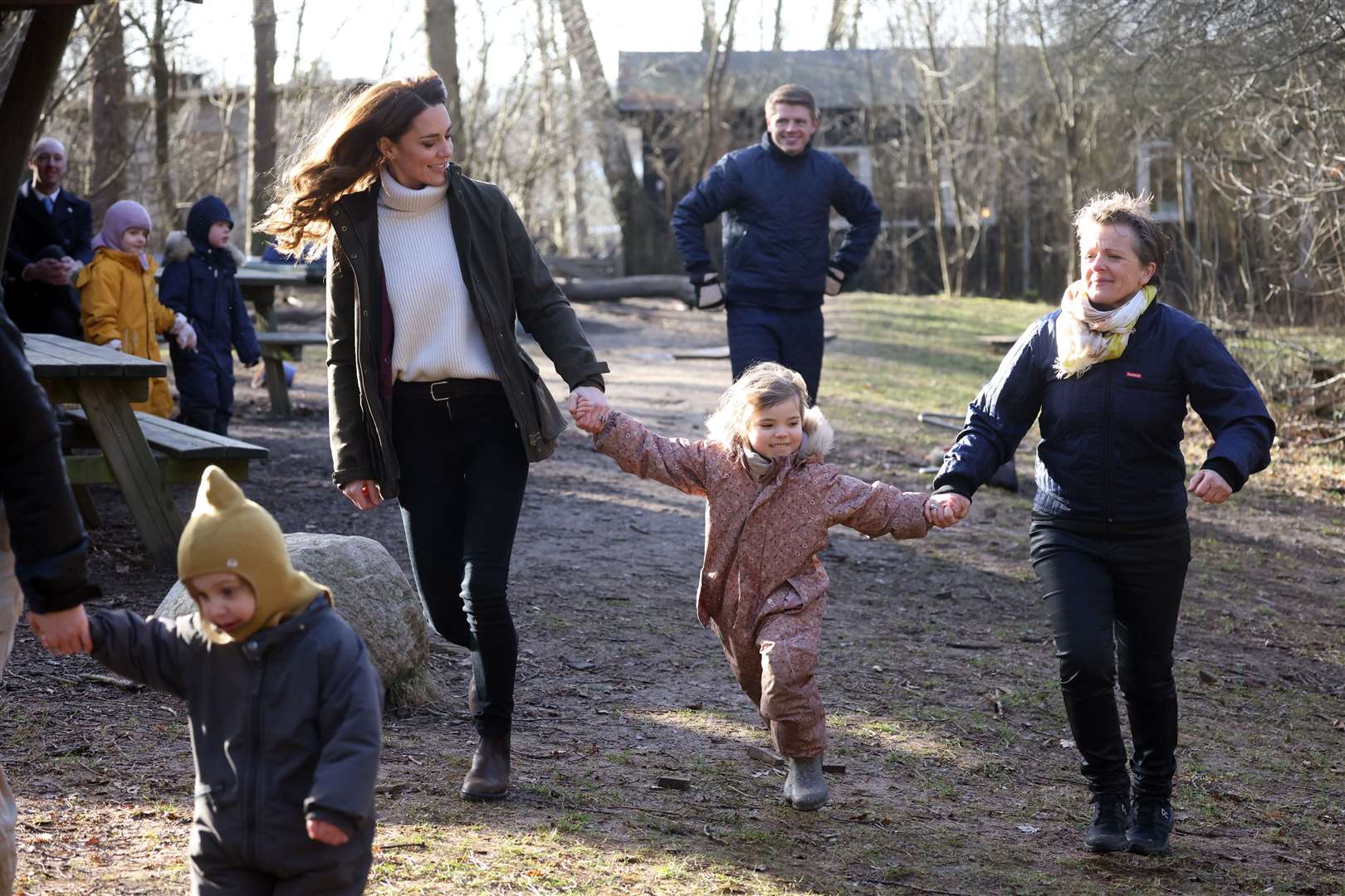 Kate held hands with one of the forest school’s pupils as they went on a woodland walk (Ian Vogler/Daily Mirror/PA)