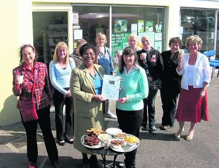 Tammy Stewart-Jones (left), chairman of Thanet Fairtrade Initiative and Glen Allramseder, proprietor of Kaylens Health Foods, with guests at the launch the shop's new base with a tasting of Fairtrade foods sold.