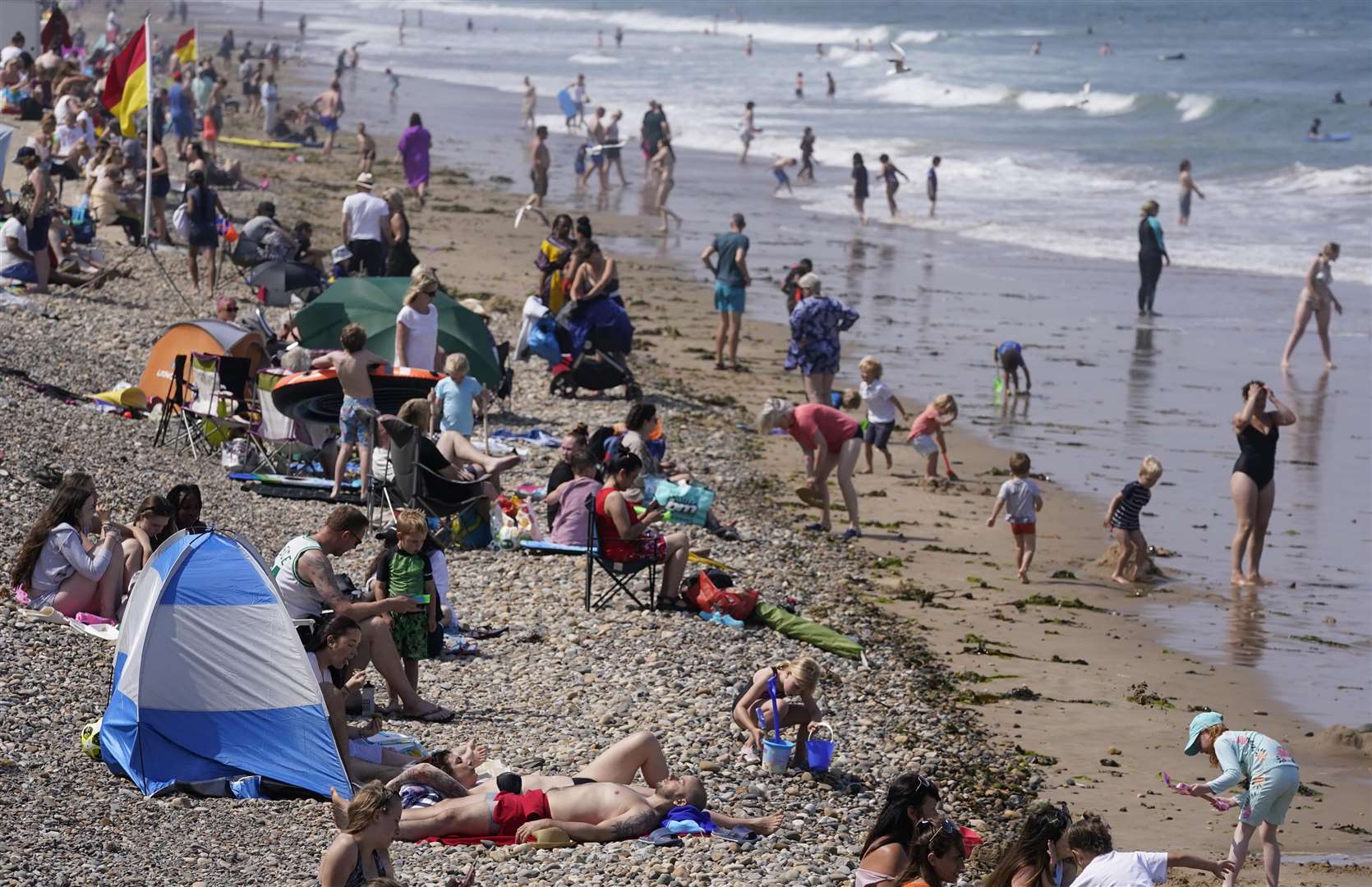 People at the beach in Saltburn-by-the-Sea in North Yorkshire amid the heatwave on July 22 (Owen Humphreys/PA)