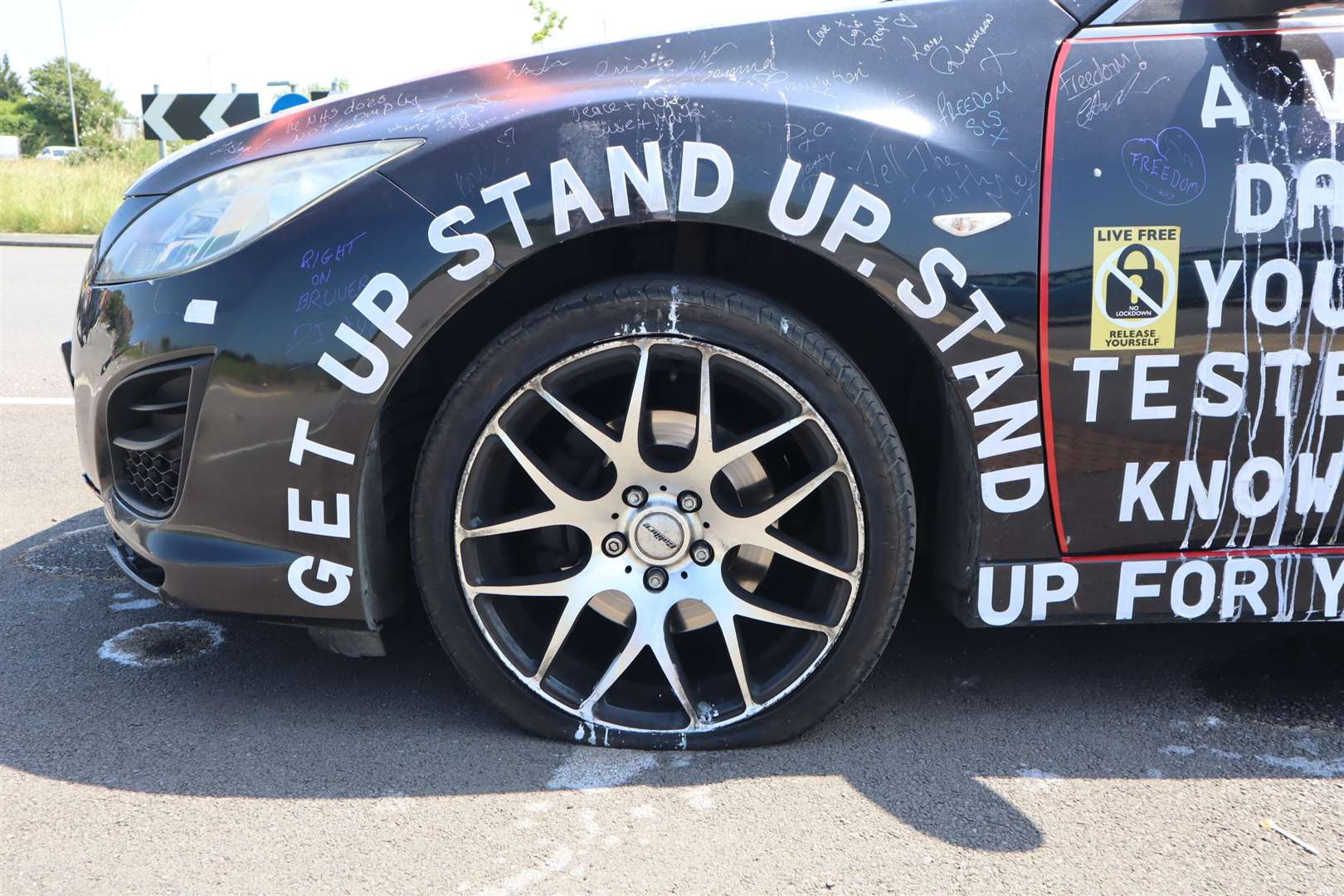 Message on the 'anti-covid' car parked at the Lower Road roundabout at Minster, Sheppey. It had its tyres slashed and daubed with red spray paint