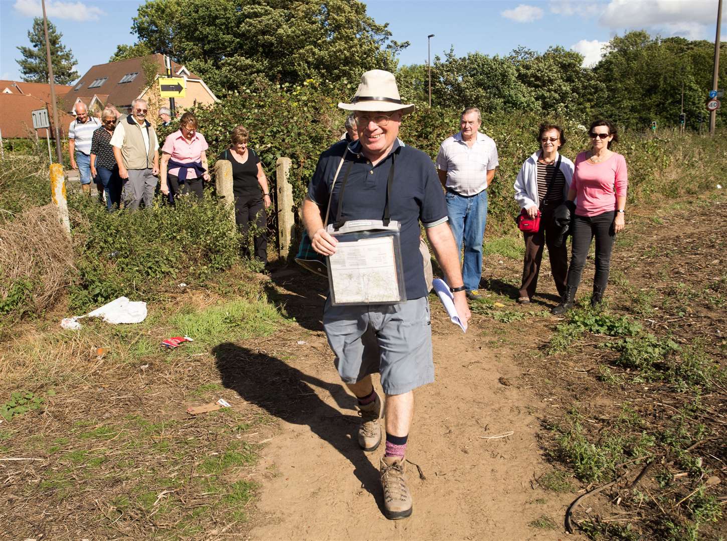 Parish Council Chairman David Thornewell leading a protest walk through the green fields at Broadwater Farm