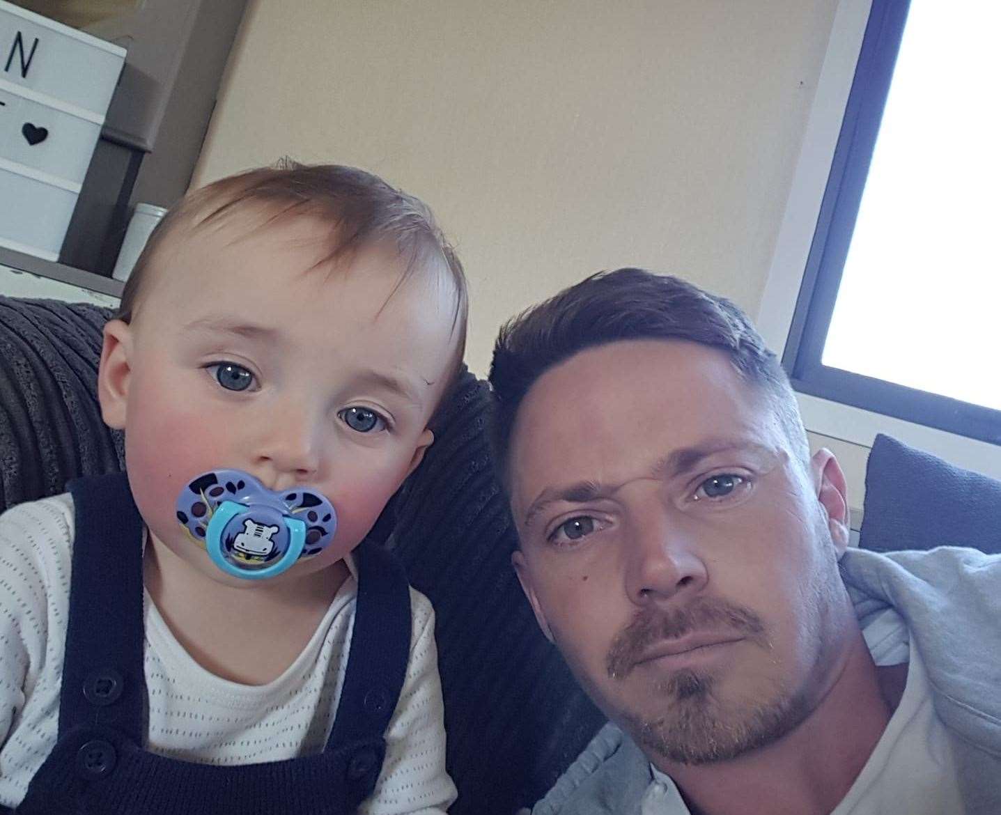 Alfie Phillips with his heartbroken dad, Sam