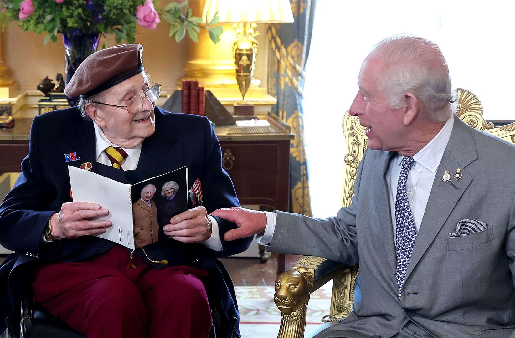 The King presented D-Day veteran Jim Miller with a card to mark his 100th birthday at Buckingham Palace (Chris Jackson/PA)