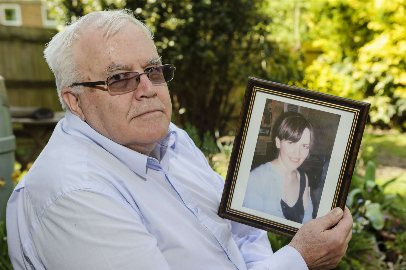 Phil Kerton with a picture of his daughter, Louise