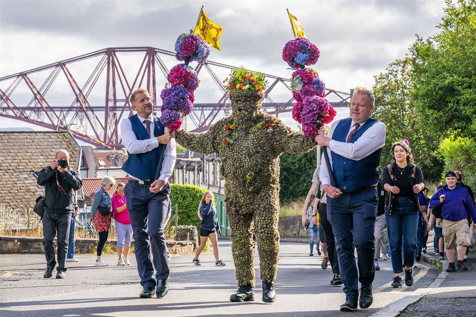 Burryman Andrew Taylor parades through the town of South Queensferry encased in burrs. The parade takes place on the second Friday of August each year and is said to bring the town good luck (Jane Barlow/PA)