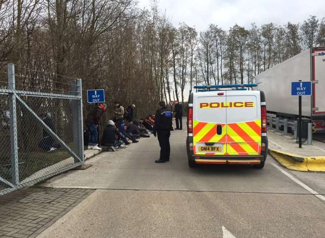 The refugees lined up at the roadside