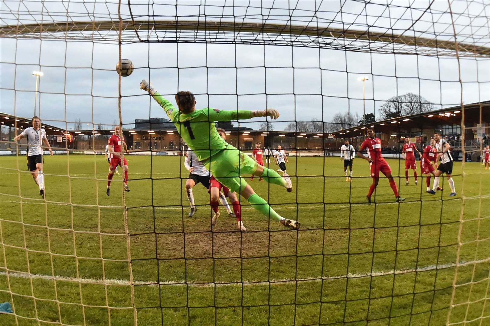 Hungerford keeper Luke Cairney somehow keeps out Tom Bonner's header. Picture: Keith Gillard