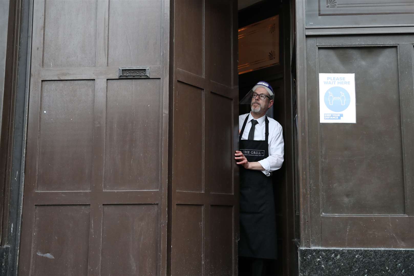 The doors of all pubs, cafes and restaurants were closed on Wednesday evening as new lockdown restrictions were imposed on the city (Andrew Milligan/PA)