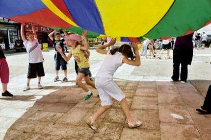 Youngsters on a special day out play games on Herne Bay seafront