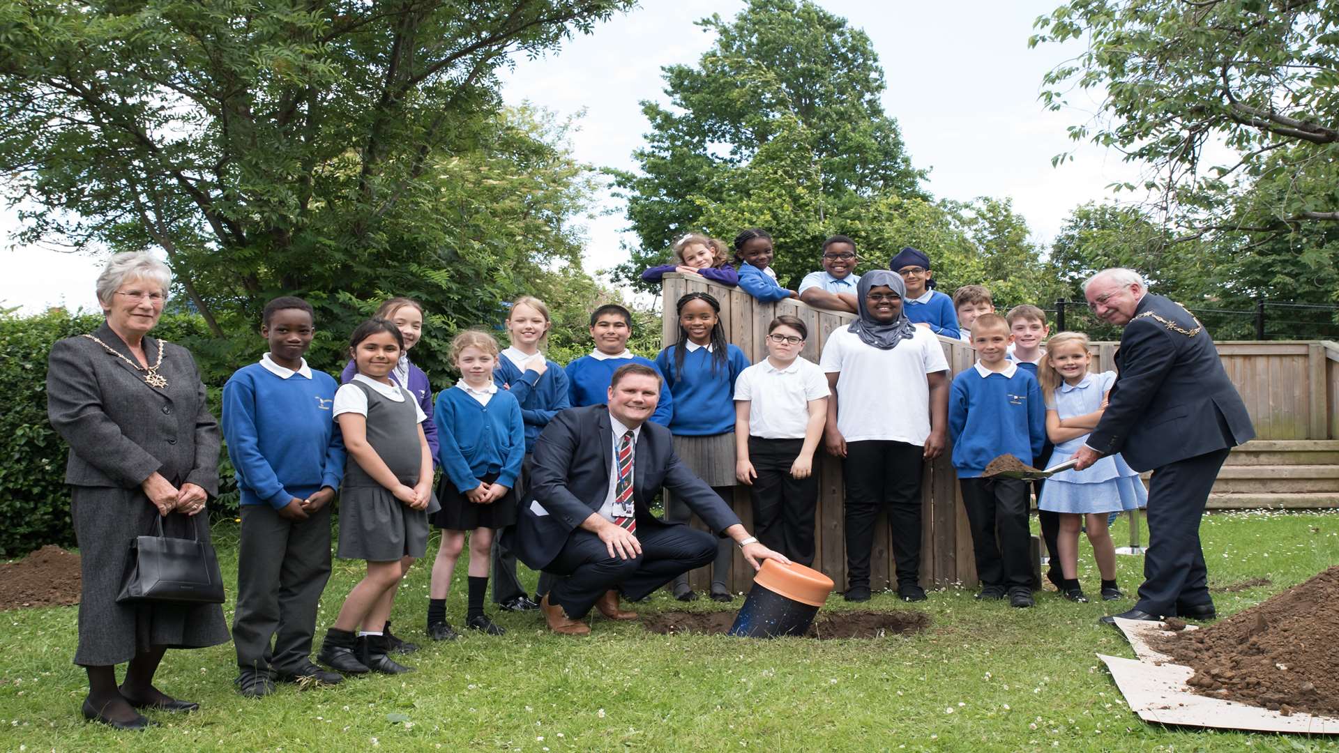 Gravesham Mayor Cllr Harold Craske helps head teacher Malcolm Moaby bury the time capsule. Picture: Lianne Pond